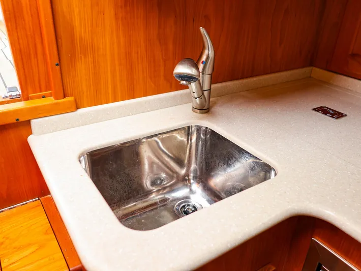 4814ak Yacht Photos Pics Stainless steel sink with modern faucet in 2009 Legacy 32 boat kitchen.