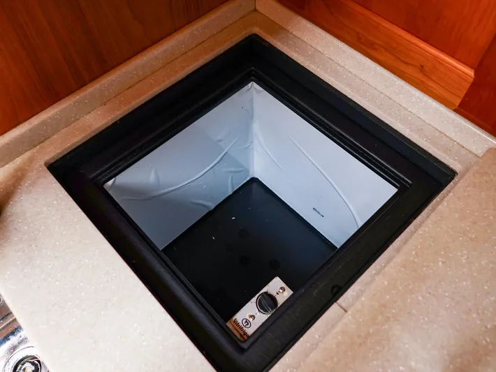 4814ak Yacht Photos Pics Built-in cooler compartment on a 2009 Legacy 32 boat, featuring a sleek countertop design.