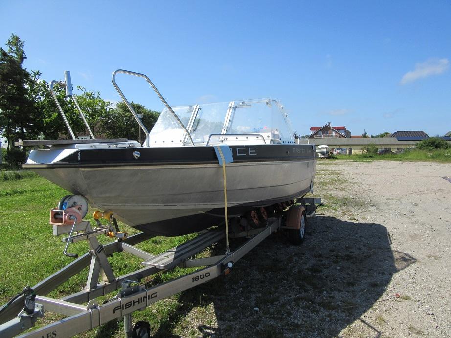 2016 Master Pro 571 boat on trailer in sunny outdoor setting.