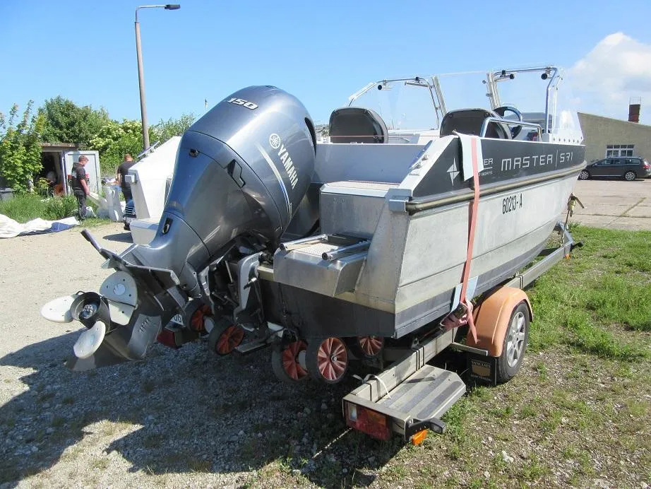 2016 Master Pro 571 boat on trailer with Yamaha outboard motor.