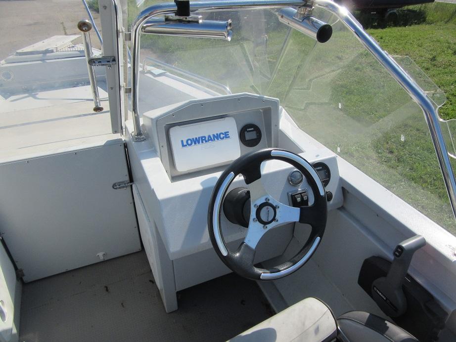 Steering console of 2016 Master Pro 571 boat with Lowrance navigation system.