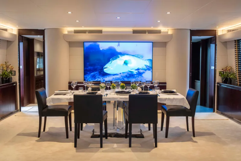 Bellini Yacht Photos Pics Luxurious dining area on 1988 Cantieri di Pisa AKHIR 30 yacht, featuring elegant table setting.