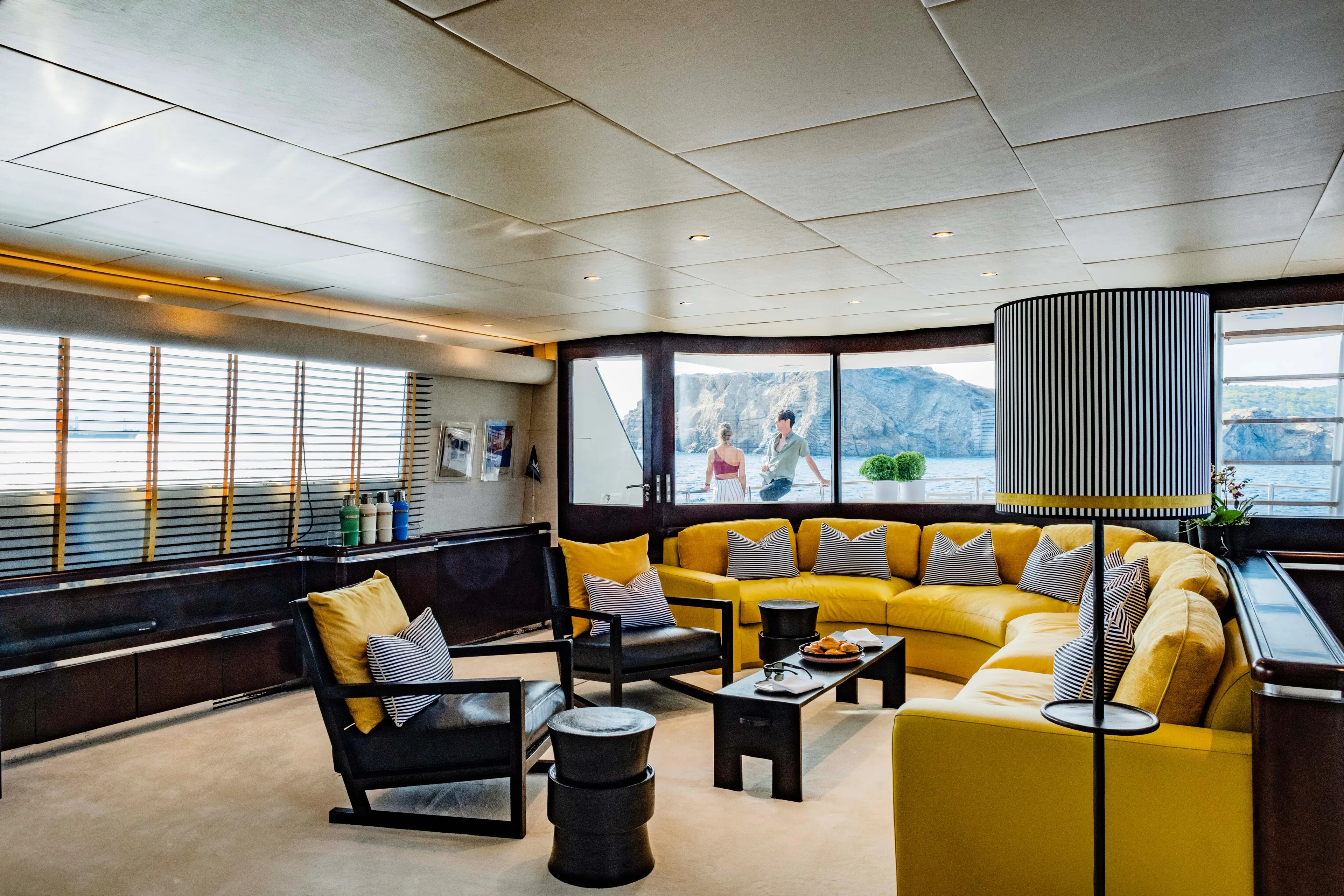 Bellini Yacht Photos Pics Luxurious 1988 Cantieri di Pisa AKHIR 30 yacht interior with yellow seating and modern decor.