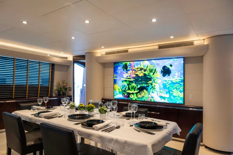 Bellini Yacht Photos Pics Luxurious dining area on 1988 Cantieri di Pisa AKHIR 30 yacht with elegant table setting.
