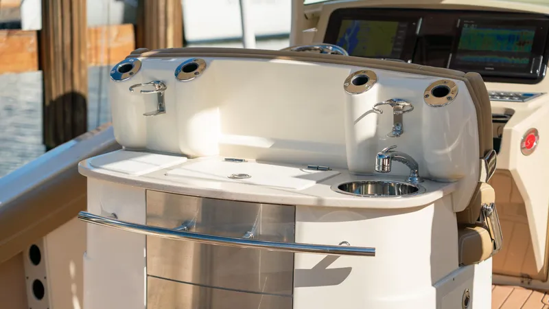  Yacht Photos Pics 2019 Scout 275 LXF boat interior with sink and control panel.