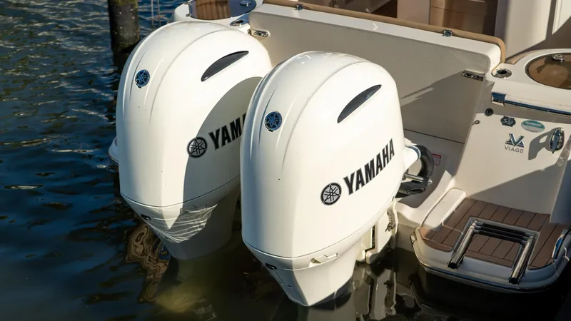  Yacht Photos Pics 2019 Scout 275 LXF boat with twin Yamaha outboard engines in water.