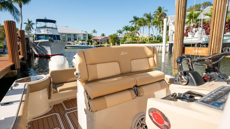  Yacht Photos Pics 2019 Scout 275 LXF boat docked in sunny marina with palm trees.