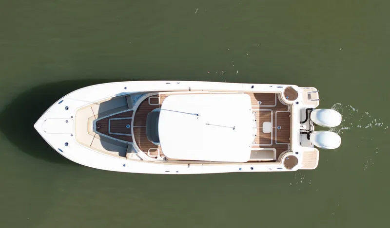  Yacht Photos Pics Aerial view of 2019 Scout 275 LXF boat on calm water.
