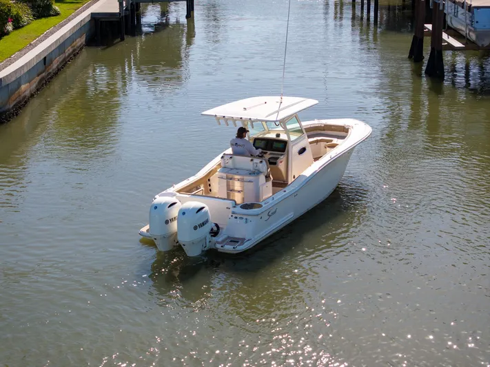  Yacht Photos Pics 2019 Scout 275 LXF boat cruising in a calm waterway with twin engines.