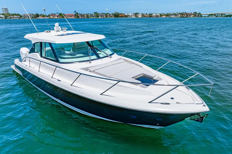  Yacht Photos Pics 2022 Tiara Yachts 43 LE cruising on clear blue water.