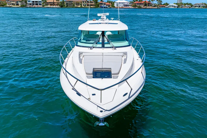  Yacht Photos Pics 2022 Tiara Yachts 43 LE cruising on clear blue water.