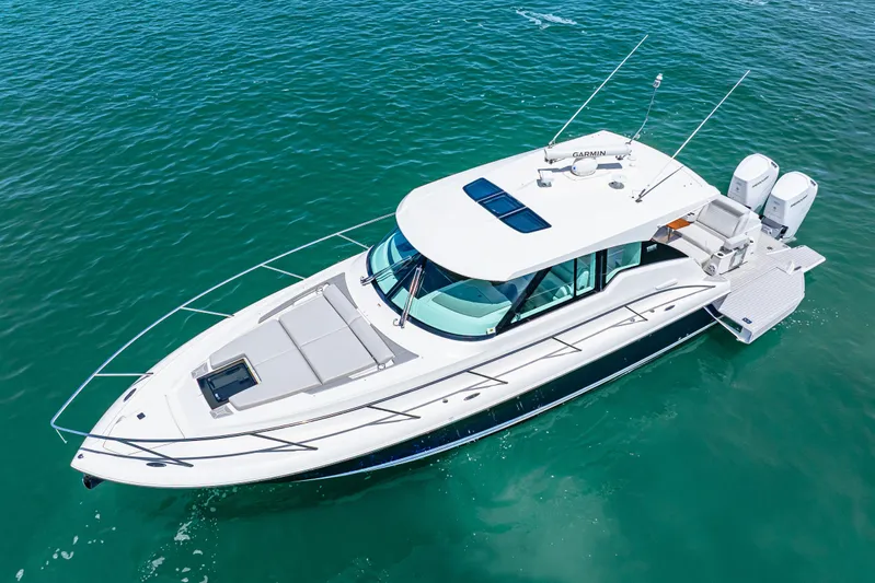  Yacht Photos Pics 2022 Tiara Yachts 43 LE cruising on clear blue water.