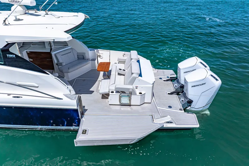  Yacht Photos Pics 2022 Tiara Yachts 43 LE with Mercury engines on clear blue water.