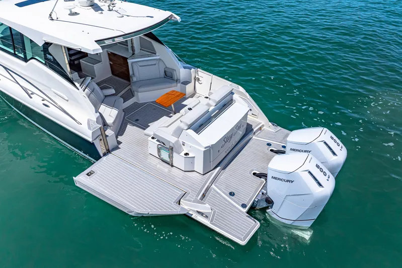  Yacht Photos Pics 2022 Tiara Yachts 43 LE with dual Mercury engines on clear water.