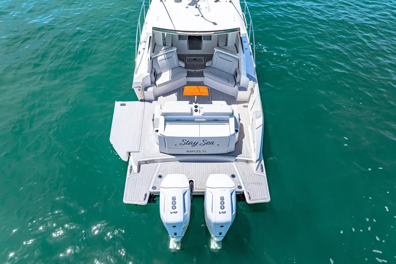  Yacht Photos Pics 2022 Tiara Yachts 43 LE on water, rear view with dual engines.