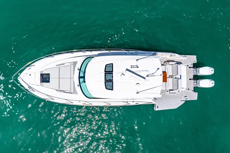  Yacht Photos Pics Aerial view of 2022 Tiara Yachts 43 LE on turquoise water.