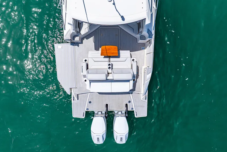  Yacht Photos Pics Aerial view of 2022 Tiara Yachts 43 LE on turquoise water.