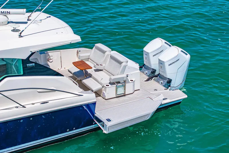  Yacht Photos Pics 2022 Tiara Yachts 43 LE with dual Mercury outboards on blue water.