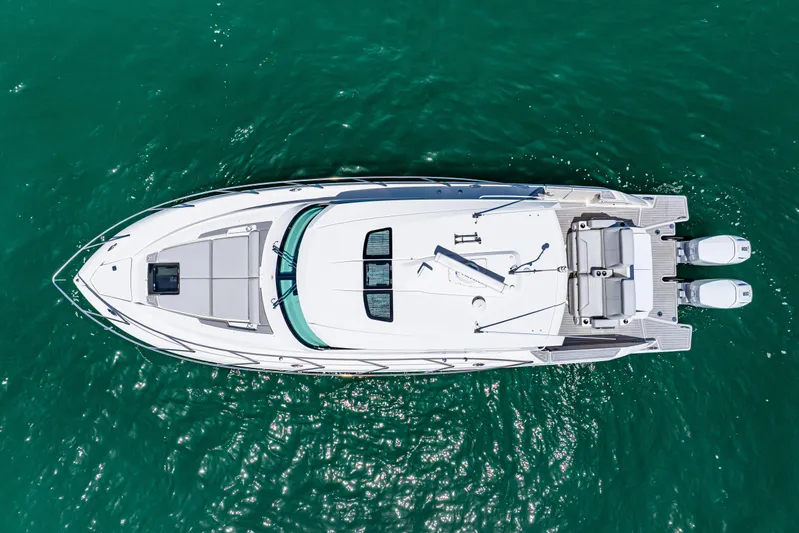  Yacht Photos Pics Aerial view of 2022 Tiara Yachts 43 LE on turquoise water.