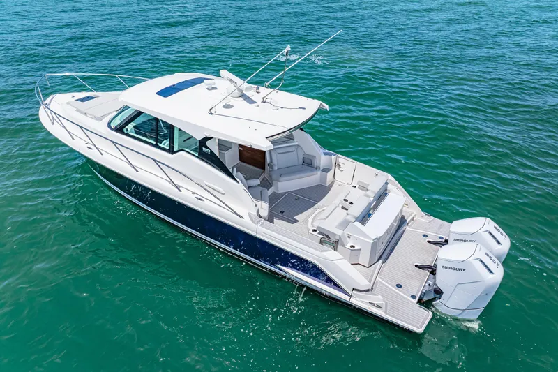  Yacht Photos Pics 2022 Tiara Yachts 43 LE cruising on clear blue water.