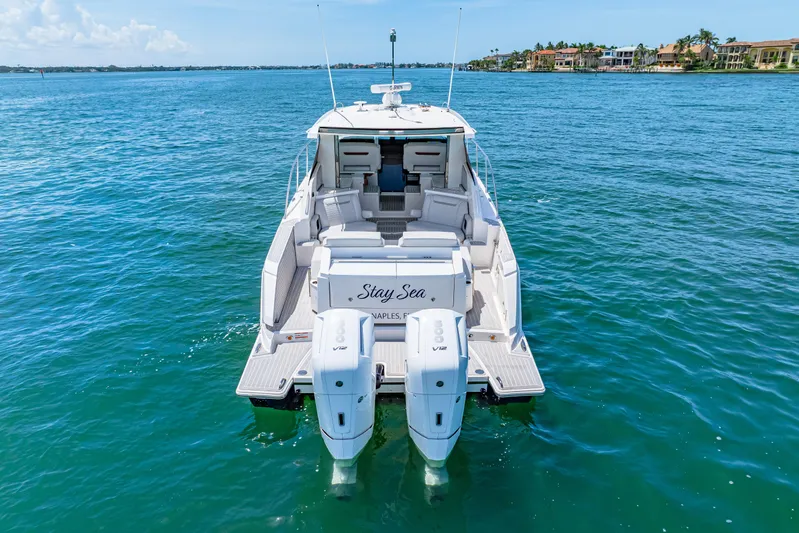  Yacht Photos Pics 2022 Tiara Yachts 43 LE on water, rear view with twin engines.