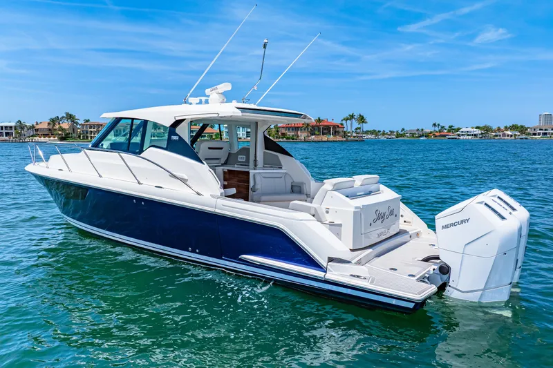  Yacht Photos Pics 2022 Tiara Yachts 43 LE on water, featuring sleek design and powerful Mercury engines.