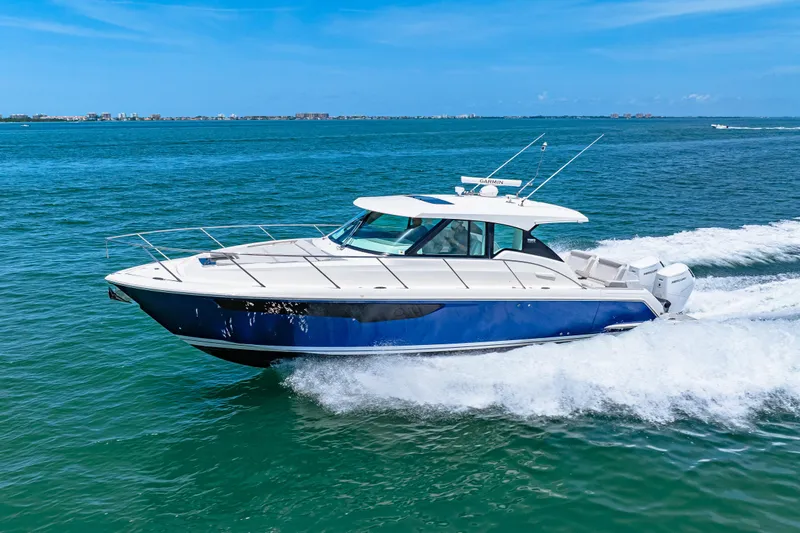  Yacht Photos Pics 2022 Tiara Yachts 43 LE cruising on blue ocean under clear sky.