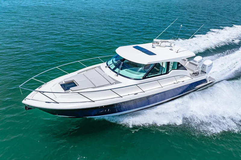 Yacht Photos Pics 2022 Tiara Yachts 43 LE cruising on clear blue water.