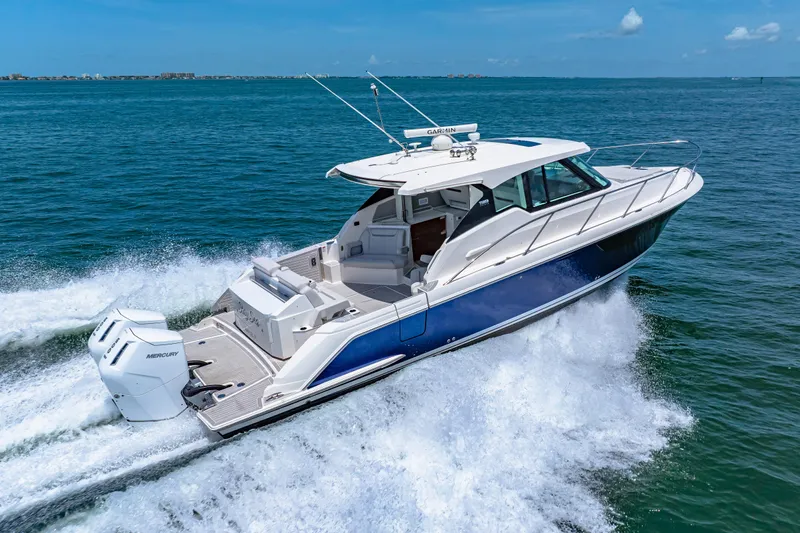  Yacht Photos Pics 2022 Tiara Yachts 43 LE cruising on open water, showcasing sleek design and powerful engines.