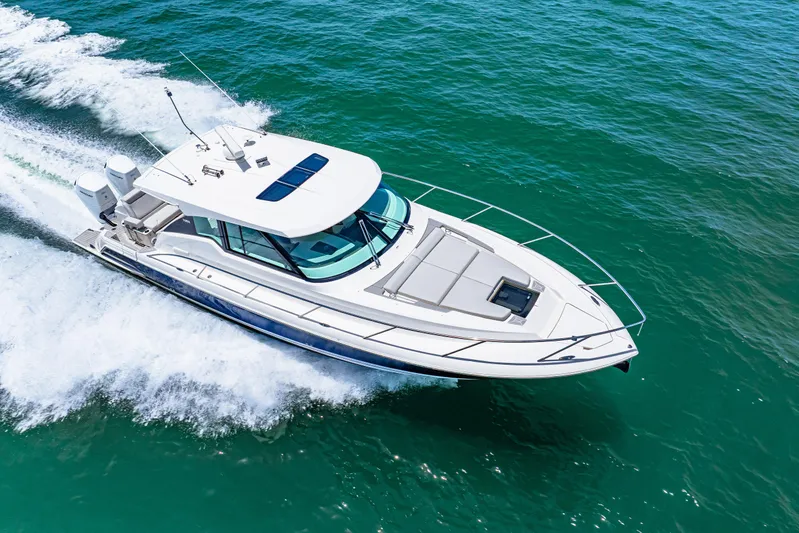  Yacht Photos Pics 2022 Tiara Yachts 43 LE cruising on clear blue water.