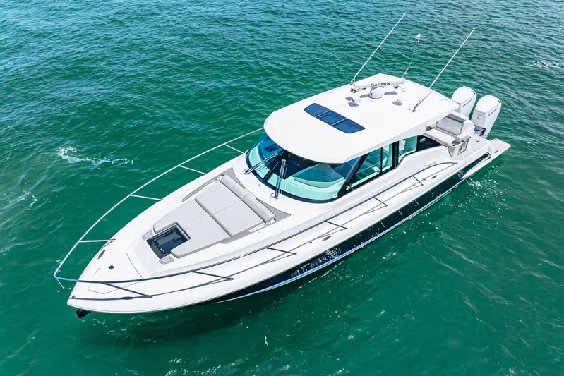  Yacht Photos Pics 2022 Tiara Yachts 43 LE cruising on clear blue water.