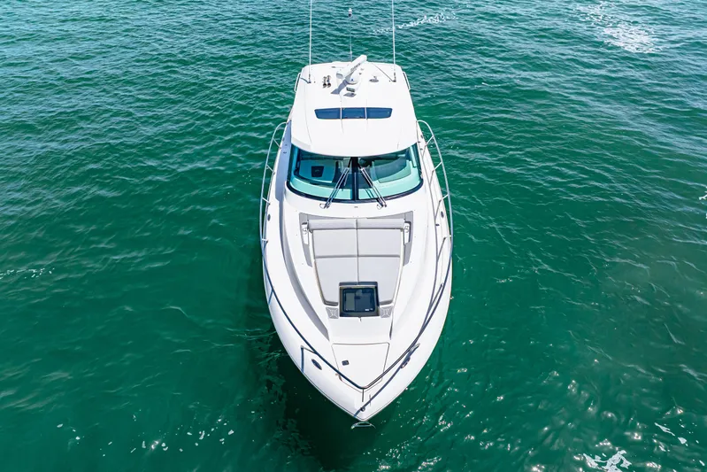  Yacht Photos Pics 2022 Tiara Yachts 43 LE cruising on clear blue water, aerial view.