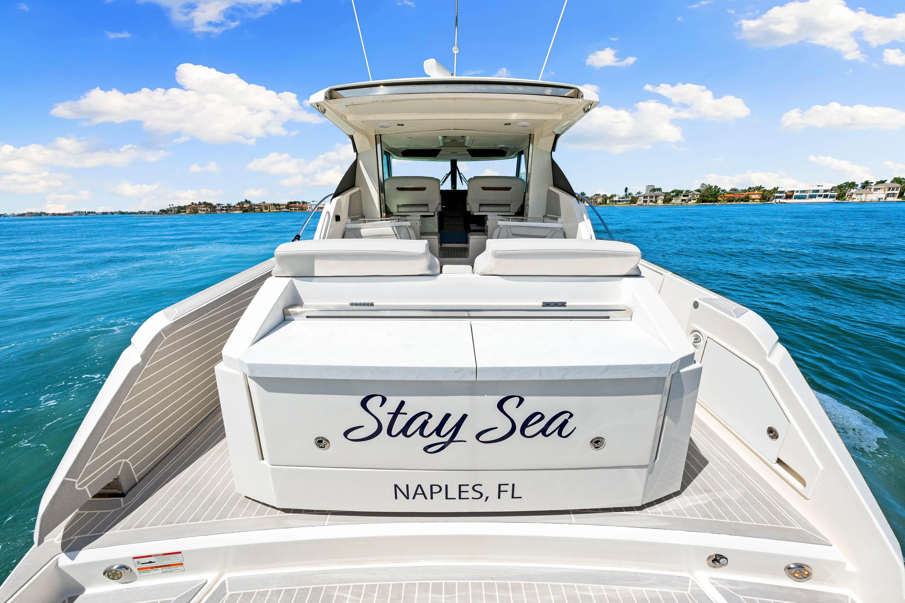  Yacht Photos Pics 2022 Tiara Yachts 43 LE named "Stay Sea" in Naples, FL, on blue ocean waters.