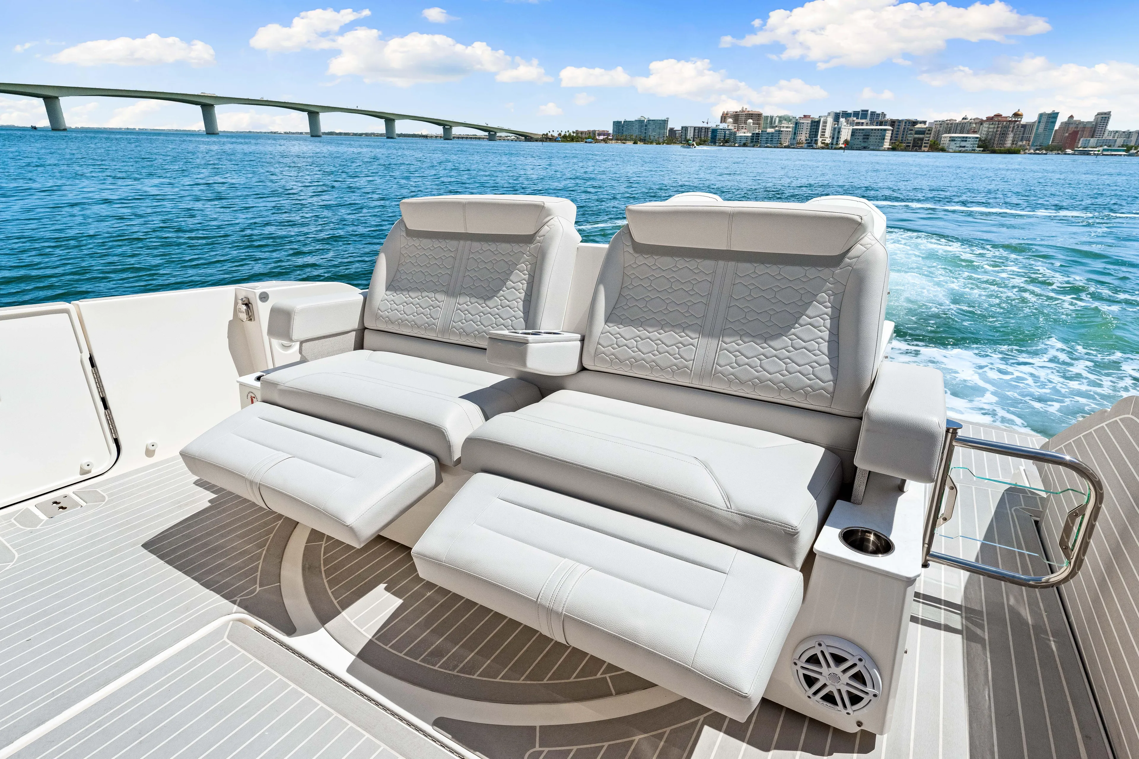 Yacht Photos Pics Luxurious seating on 2022 Tiara Yachts 43 LE, with ocean view and city skyline.