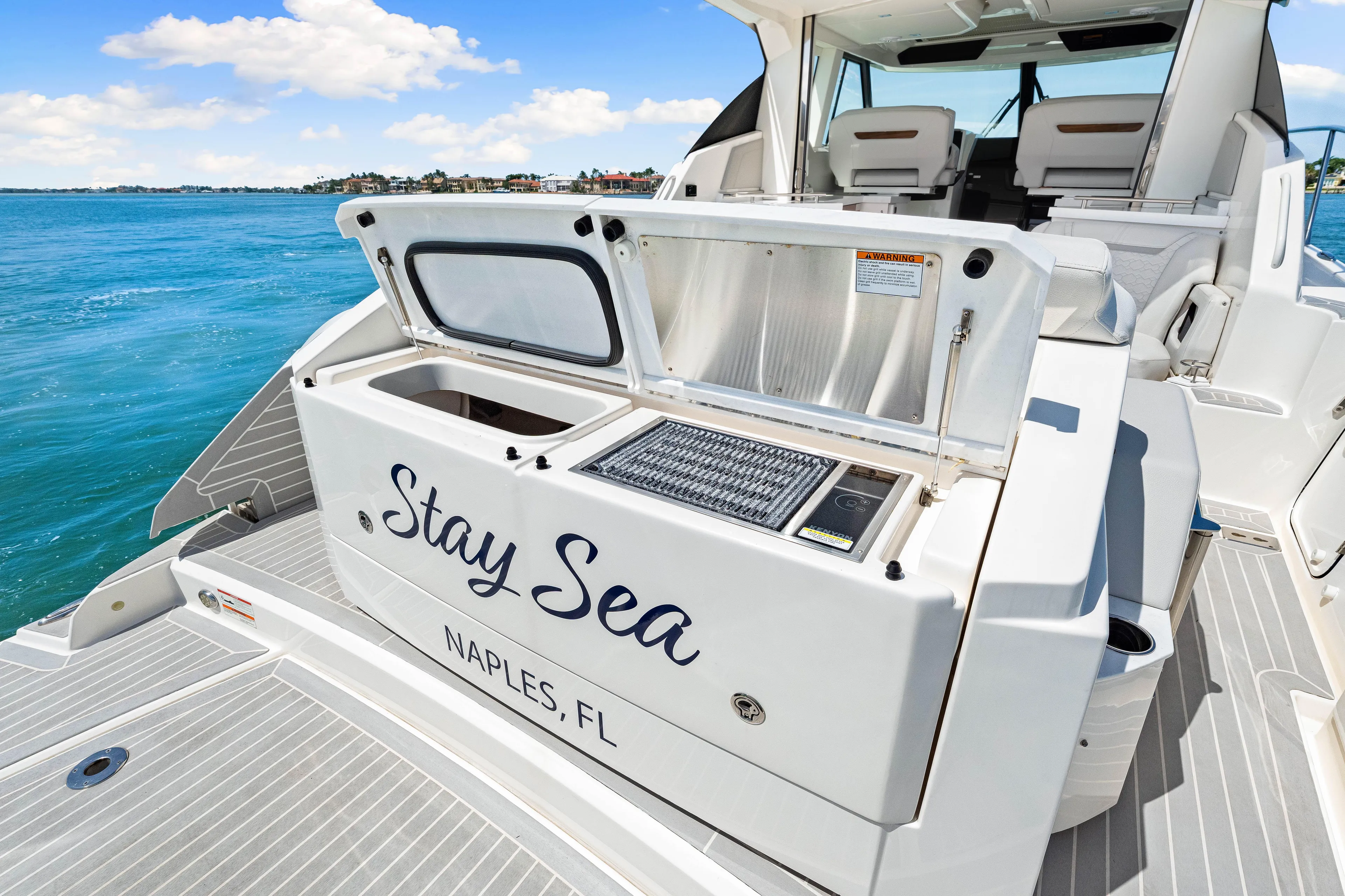  Yacht Photos Pics 2022 Tiara Yachts 43 LE, "Stay Sea," docked in Naples, FL, with open deck storage.