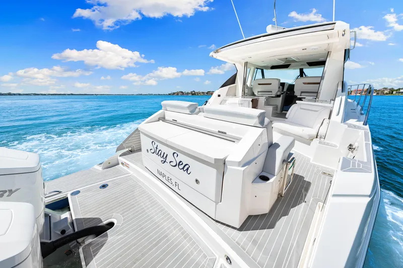  Yacht Photos Pics 2022 Tiara Yachts 43 LE cruising on blue ocean under clear sky.