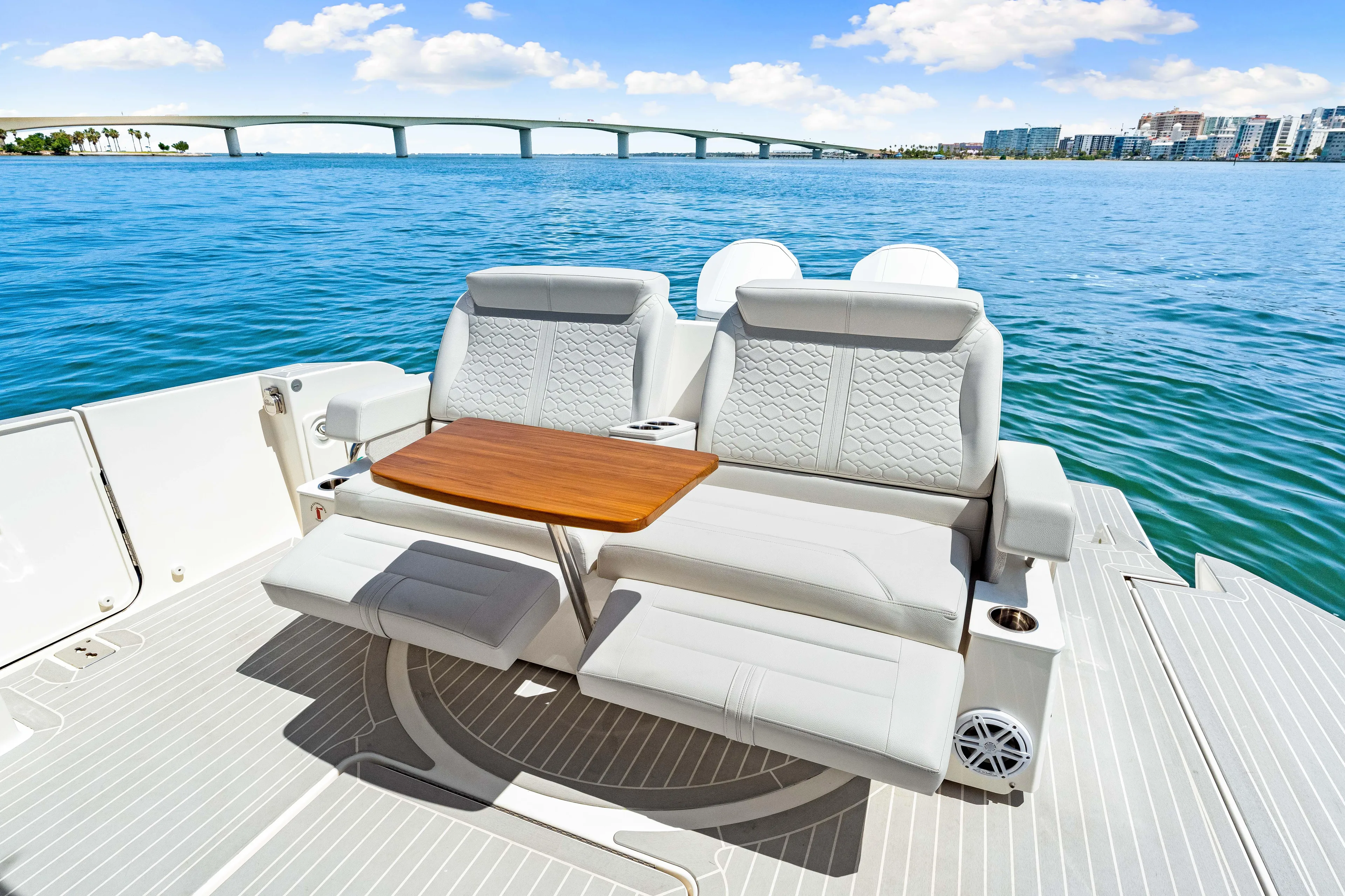  Yacht Photos Pics 2022 Tiara Yachts 43 LE luxury seating area with ocean view and bridge in background.