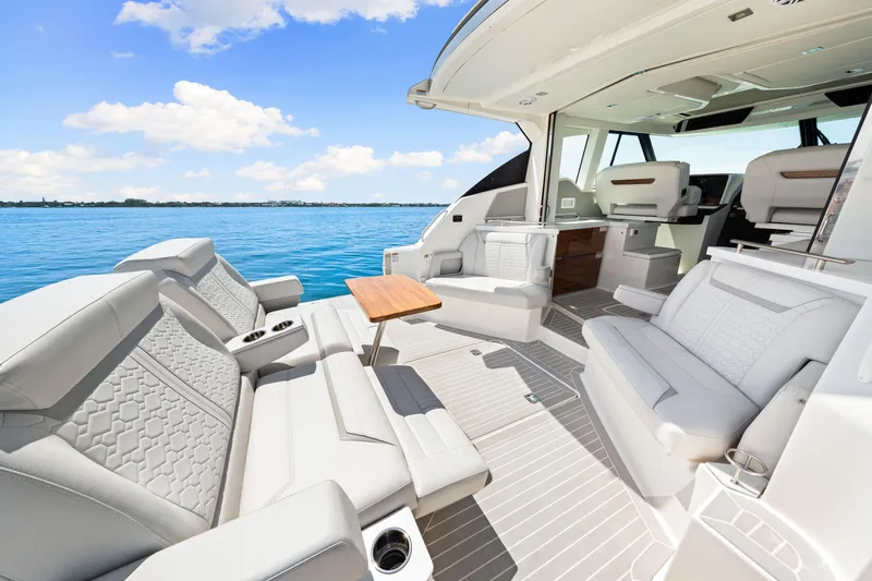  Yacht Photos Pics Luxurious 2022 Tiara Yachts 43 LE interior with elegant seating and ocean view.