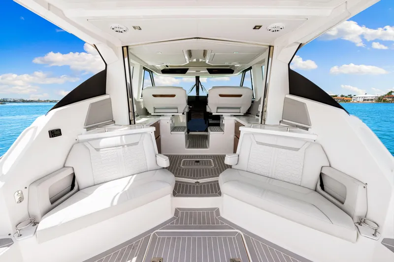  Yacht Photos Pics 2022 Tiara Yachts 43 LE interior with luxurious seating and modern design on a sunny day.
