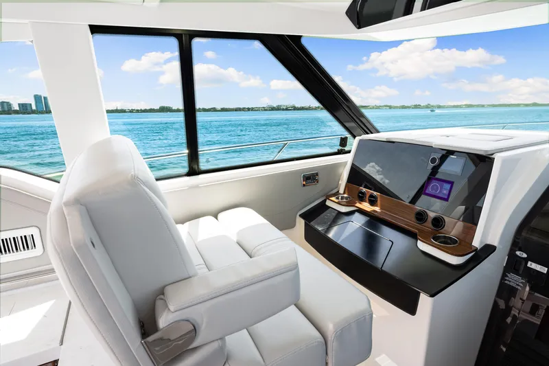  Yacht Photos Pics Interior of 2022 Tiara Yachts 43 LE, featuring modern helm and ocean view.