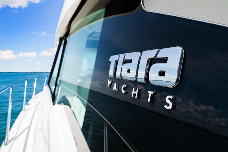  Yacht Photos Pics 2022 Tiara Yachts 43 LE, sleek design, cruising on blue ocean waters.