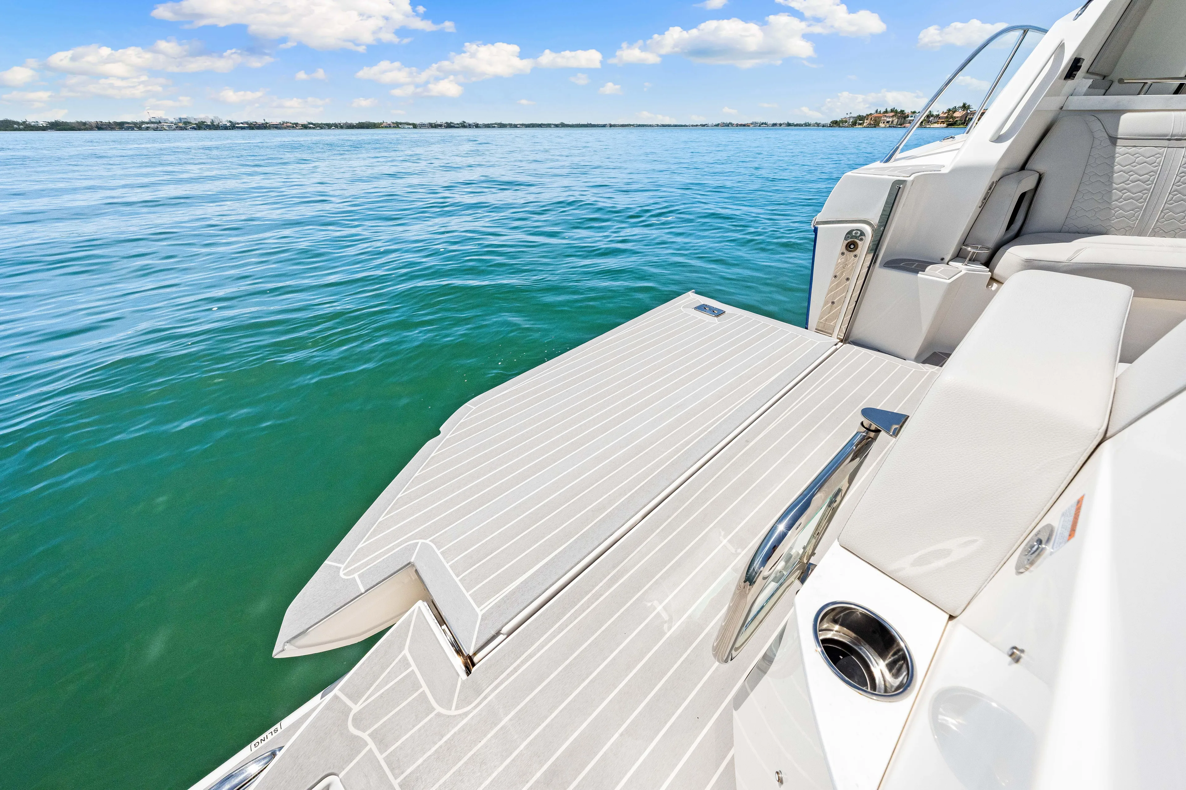  Yacht Photos Pics 2022 Tiara Yachts 43 LE swim platform on calm blue water.