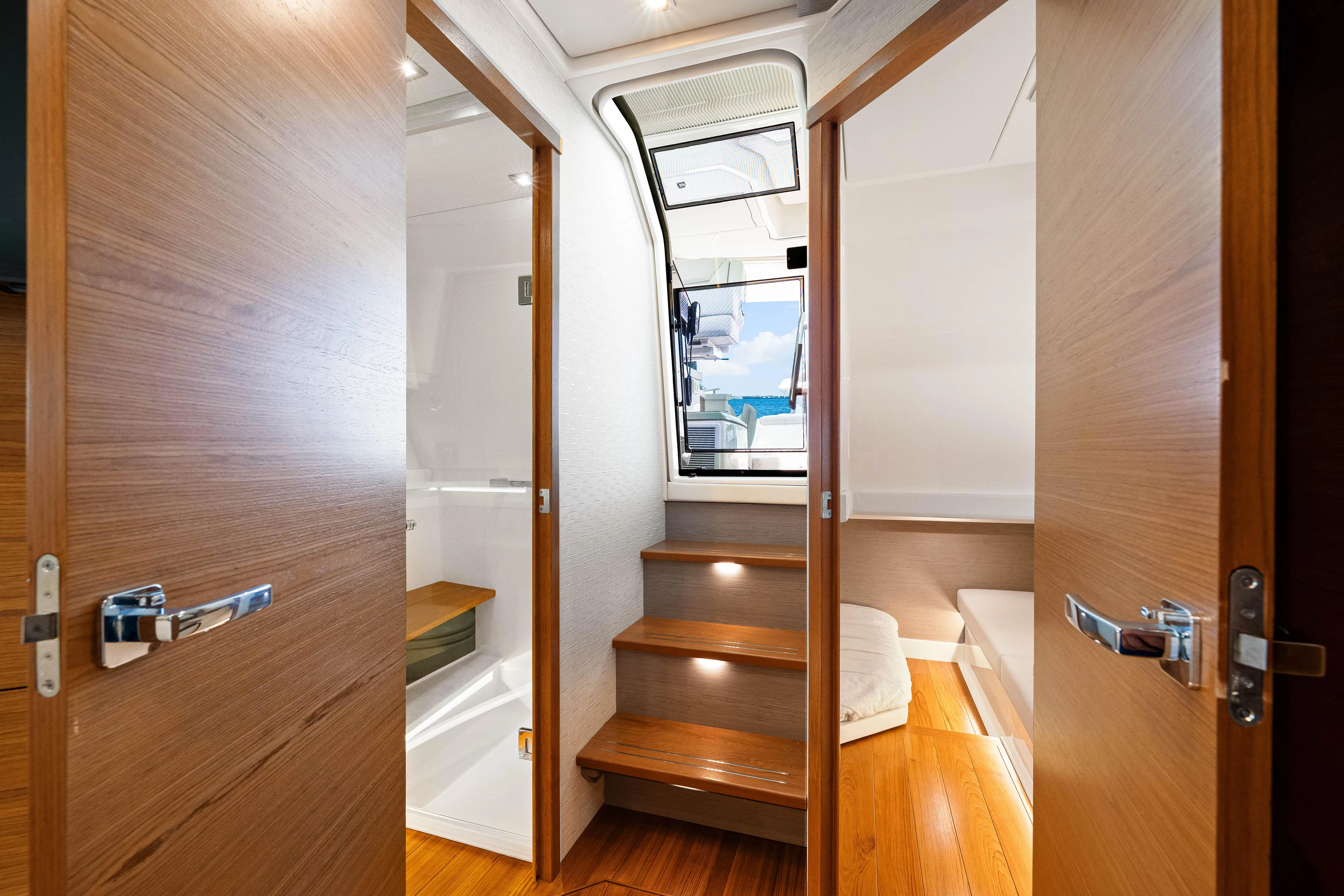  Yacht Photos Pics Interior view of 2022 Tiara Yachts 43 LE, featuring wooden doors and steps.