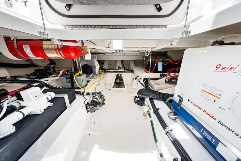  Yacht Photos Pics Engine room of 2022 Tiara Yachts 43 LE, featuring Fischer Panda generator and fire extinguisher.