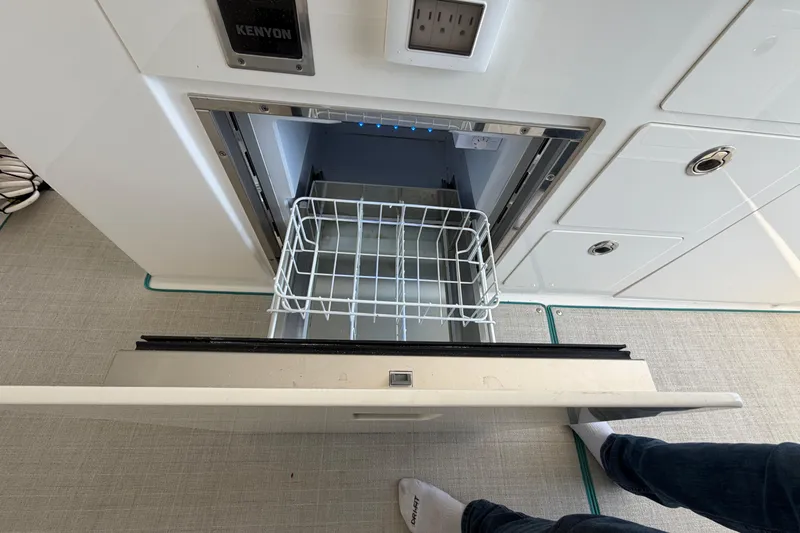  Yacht Photos Pics Open drawer on 2023 Regal 38 SAV boat, featuring a built-in Kenyon appliance.