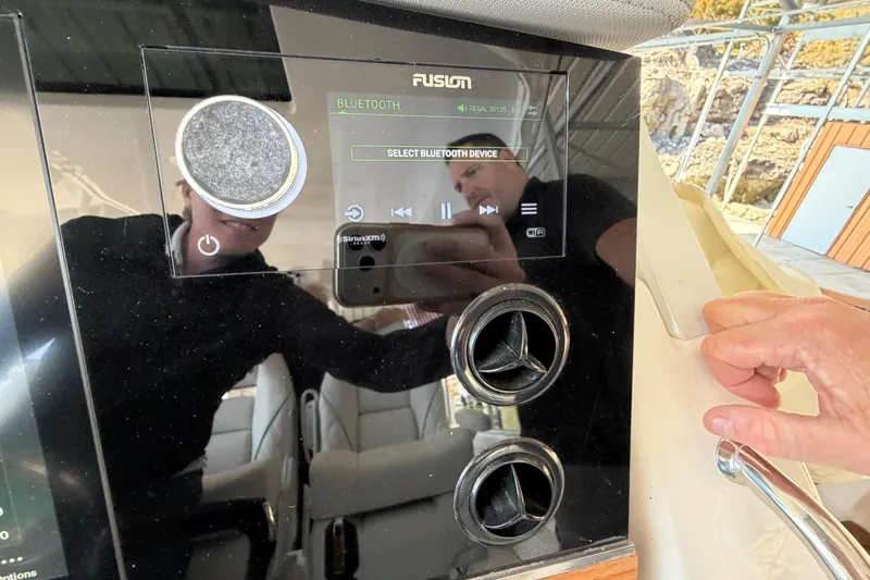  Yacht Photos Pics 2023 Regal 38 SAV boat dashboard with Bluetooth audio controls and display.