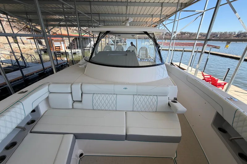  Yacht Photos Pics 2023 Regal 38 SAV luxury boat docked, featuring spacious seating and modern design.