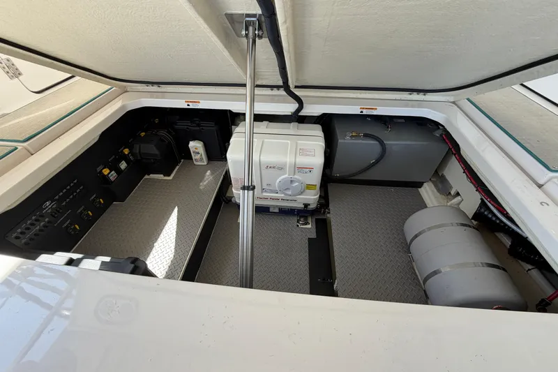  Yacht Photos Pics Engine compartment of 2023 Regal 38 SAV boat, showcasing generator and equipment.