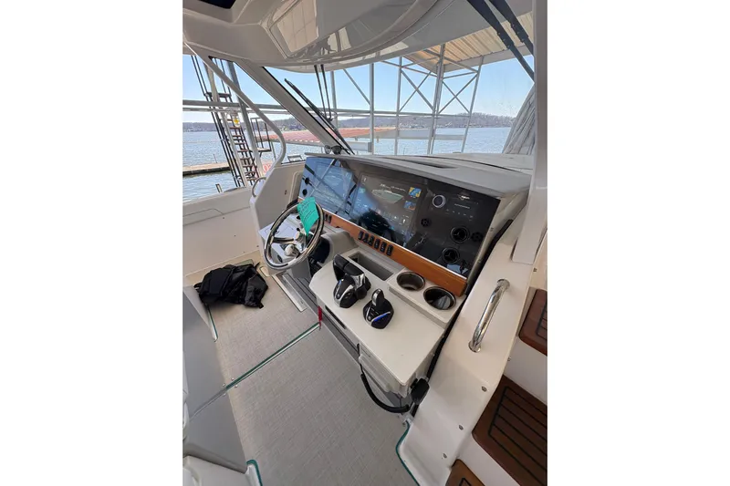  Yacht Photos Pics 2023 Regal 38 SAV boat helm with modern controls and navigation screens.