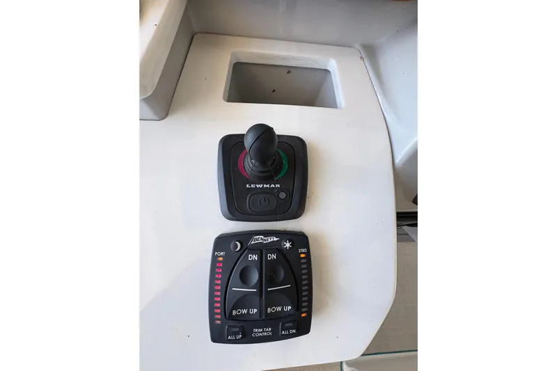  Yacht Photos Pics Control panel of 2023 Regal 38 SAV boat with joystick and trim tab controls.
